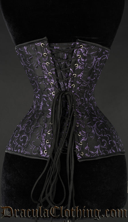 Back view of purple and black brocade extreme waist corset showing adjustable lacing over a matching fabric modesty panel