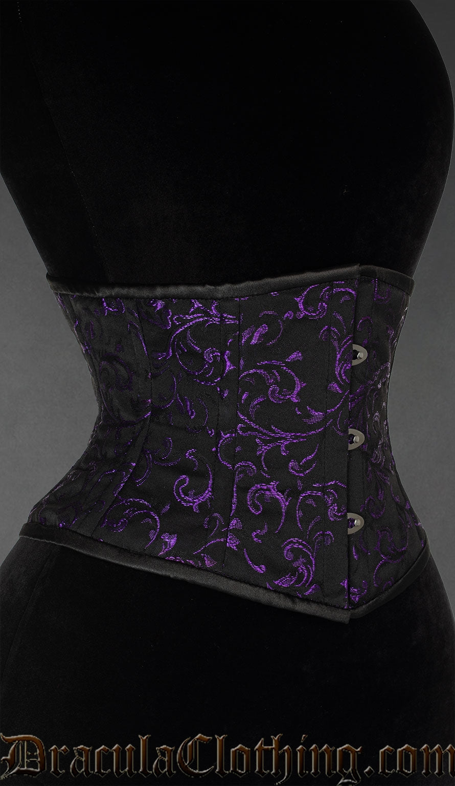 Side view of black waist cincher with purple woven details on brocade fabric