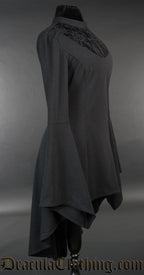 Side view of women's black high low dress showing dramatic trumpet sleeves