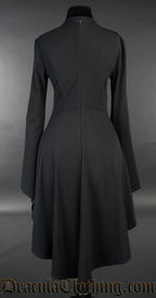 Back view of black cotton women's dress longer in the back than the front and flared trumpet sleeves