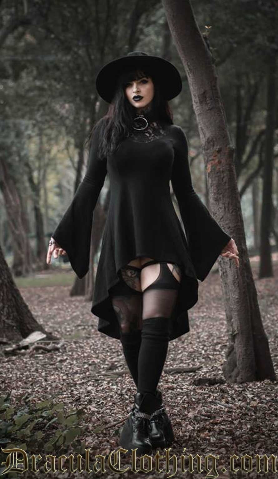 Women's black cotton high low dress with lace illusion chest panel and trumpet flared sleeves worn by model