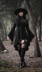 Women's black cotton high low dress with lace illusion chest panel and trumpet flared sleeves worn by model