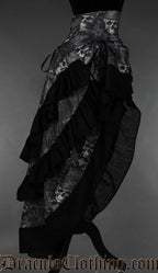 Side view of grey skull printed bustle skirt showing three layers of fabric with black cotton hem on each one