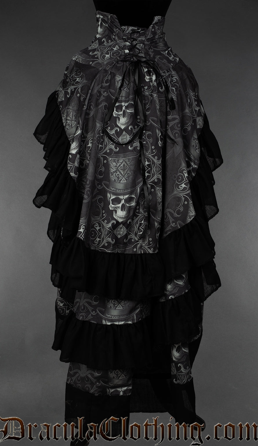 Back view of women's skull print bustle skirt showing adjustable lacing in the waist and black cotton hem on three separate layers of fabric