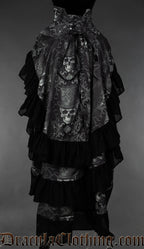 Back view of women's skull print bustle skirt showing adjustable lacing in the waist and black cotton hem on three separate layers of fabric