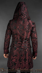 back view of hooded Victorian gothic dobby jacket with red baroque pattern styled as formal alternative menswear