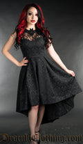 Women's sleeveless black brocade high low dress with bat shaped collar and sheer lace illusion chest panel