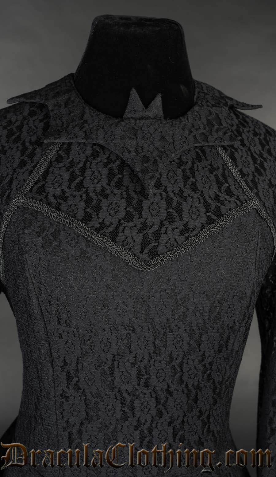 Close up of women's black dress showing sheer lace chest over a sweetheart neckline and a cute bat shaped collar