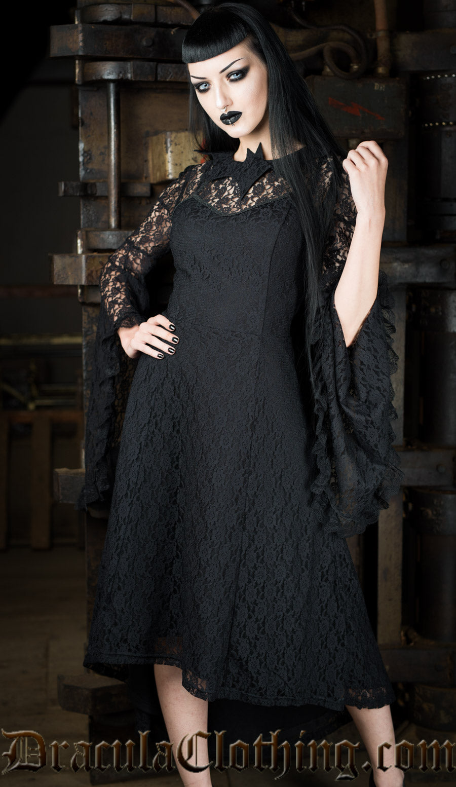 Women's black lace high low dress with dramatic lace trumpet sleeves worn by model