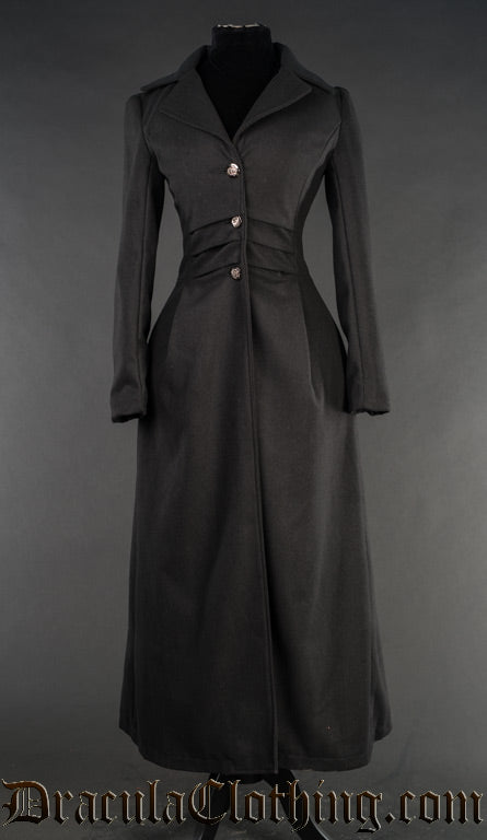 Women's long black coat with lapels and front closure with silver coloured buttons