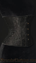 Side view of women's black brocade corset showing shaping