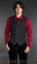Red cotton brocade shirt with black metal buttons worn with a matching black brocade vest and tie