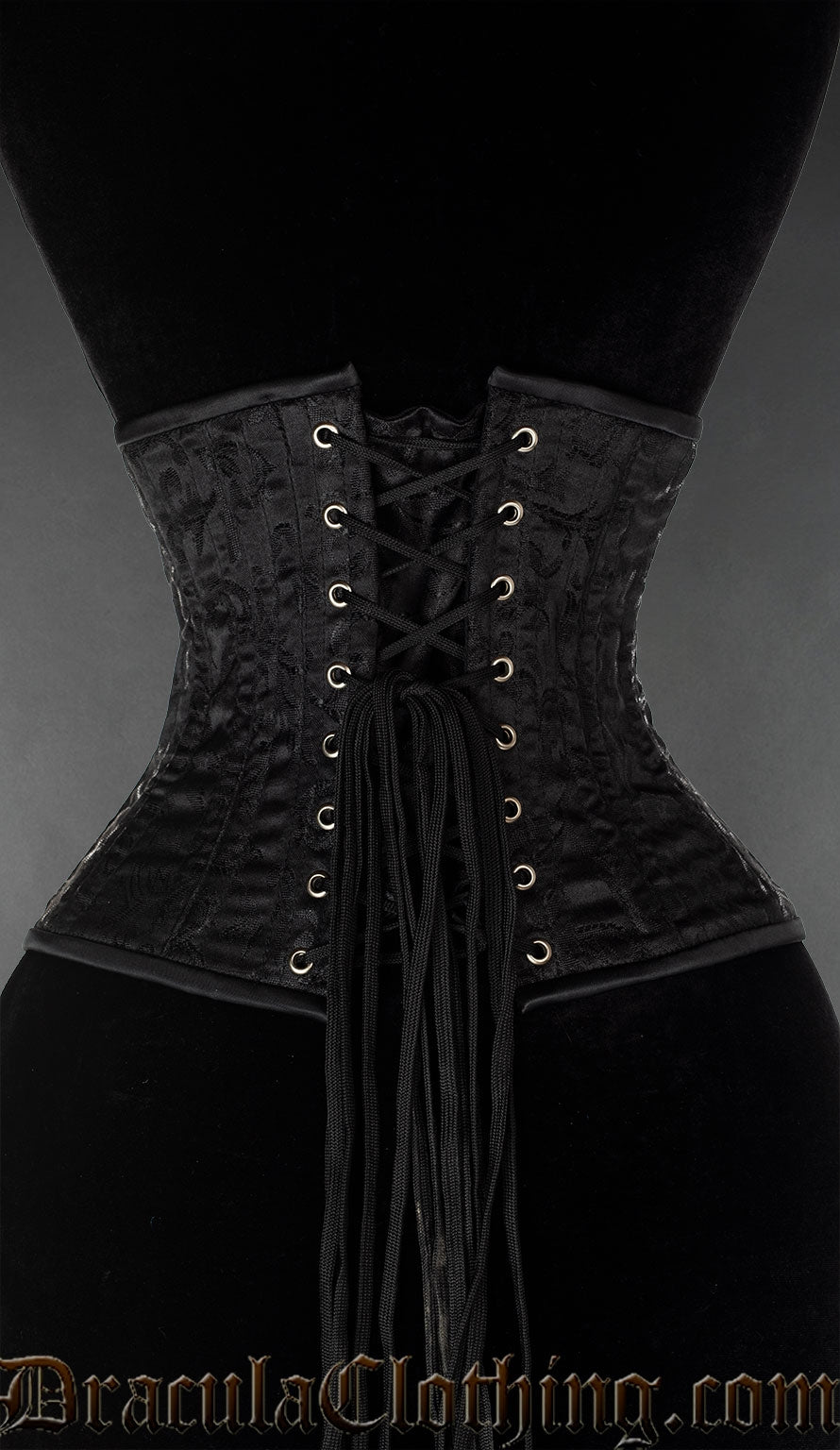 Back view of black brocade extreme waist cincher showing matching modesty panel and adjustable lacing