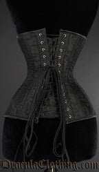Back view of black broacade extreme waist corset showing adjustable lacing and matching fabric modesty panel