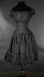 Black brocade women's knee length square neckline dress with stretchy bust and sleeves shown with waist cincher