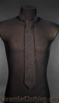 lack gothic brocade tie with subtle floral pattern displayed on a mannequin against a gray background