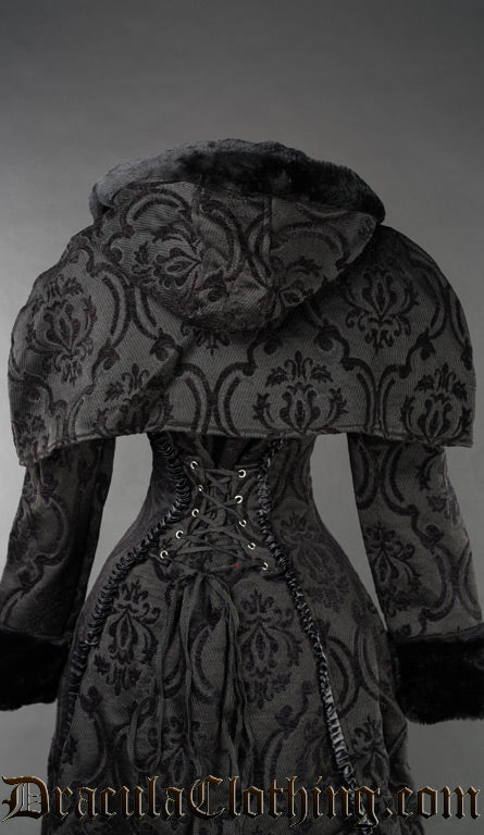 Attachable women's hood and cape shown over coat made with matching black brocade fabric