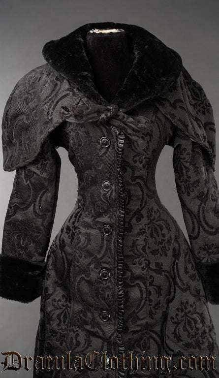 Front view of black brocade hood shown over matching women's coat