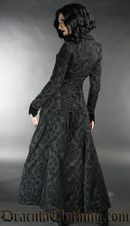 Back view of long women's black brocade coat showing adjustable corset style lacing in the back