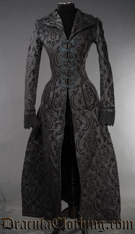 Black brocade long women's coat with centre knot fastening and lapel collar