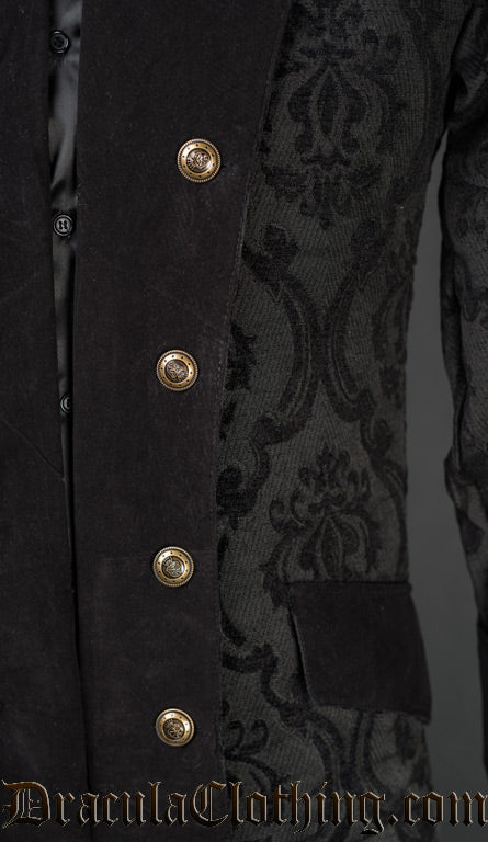 Close up of gold coloured decorative buttons and velvet lapel of men's black brocade pirate coat