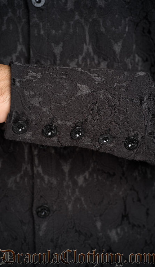 Detailed view of metal buttons with DraculaClothing etching