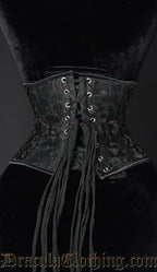 Back view of black waist cincher with woven black brocade details showing adjustable corset lacing