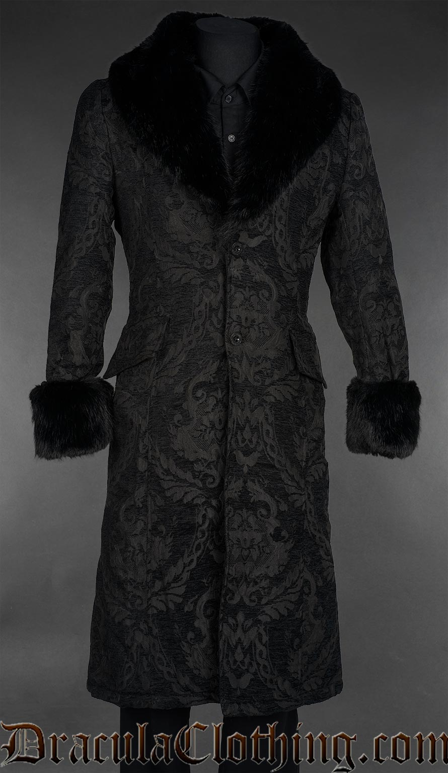 Black chenille brocade regent coat with an oversized black faux fur shawl collar, faux fur cuffs, flap pockets, a fitted silhouette, and an adjustable corset-style lace-up back.