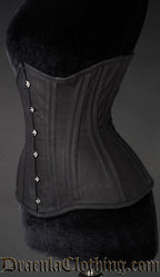 Side view of black cotton corset showing extreme waist style shaping