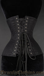 Back view of black cotton extreme waist corset showing modesty panel and adjustable lacing