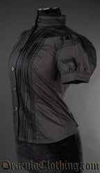 Side view of black edwardian blouse showing detail of puffed short sleeves and front pleated design