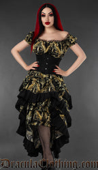 Black and gold cherub print layer bustle skirt with corset waist worn by a model against a gray background