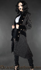 Model wearing women's black pirate inspired coat with velvet accents and decorative buttons