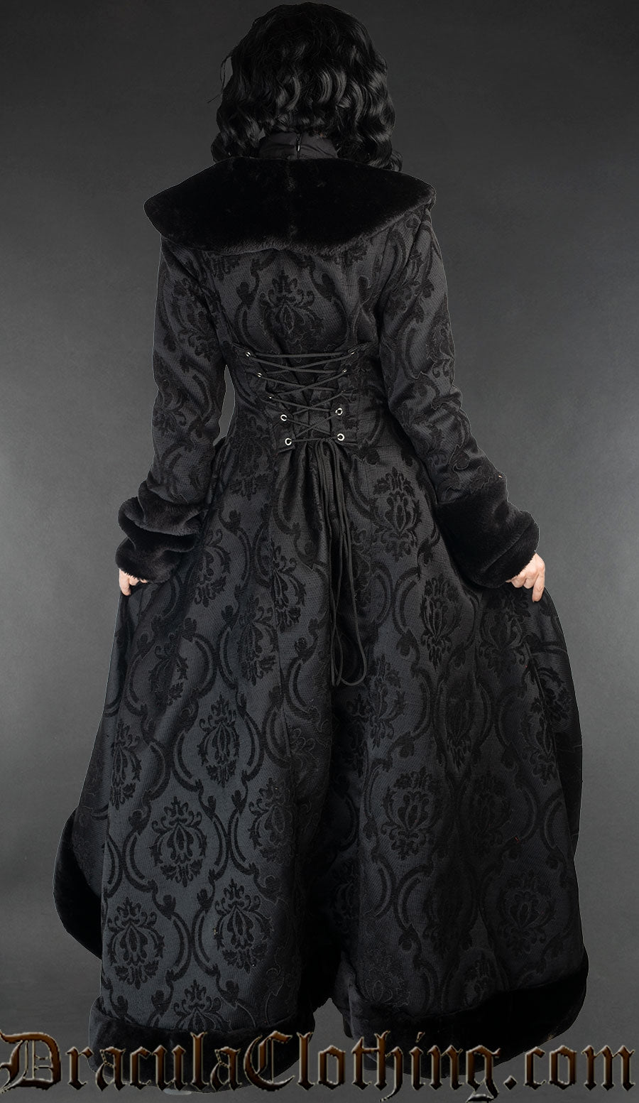Back view of women's gothic black brocade coat in a damask pattern with adjustable corset-style laced back