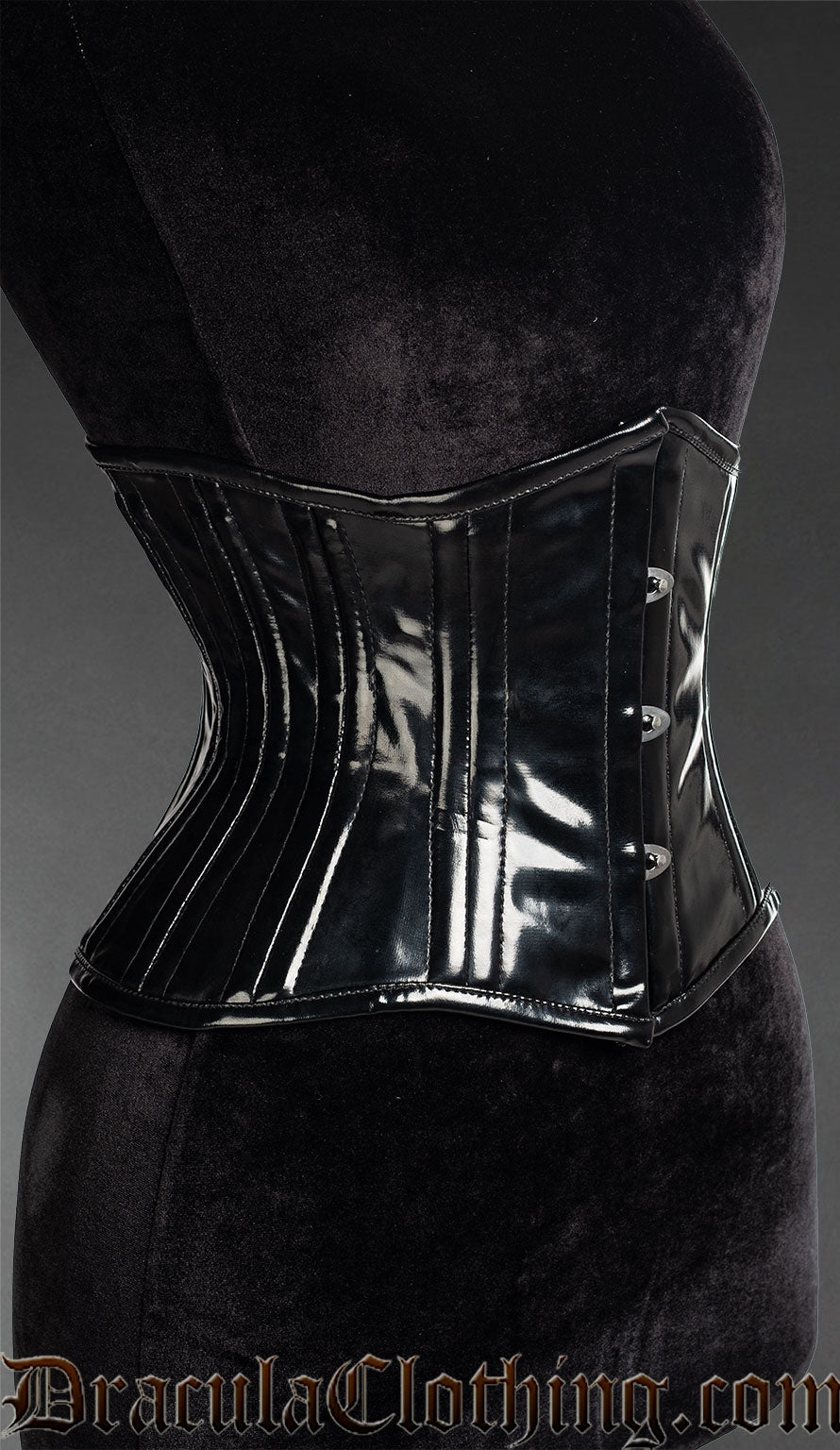 Side view of women's black PVC double boned waist cincher showing shaping