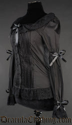 Side view of black blouse showing pleated design on the front and ribbon bows on the sleeves