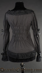 Back view of women's black blouse showing elasticated back and elastic in the sleeves for a dynamic fit