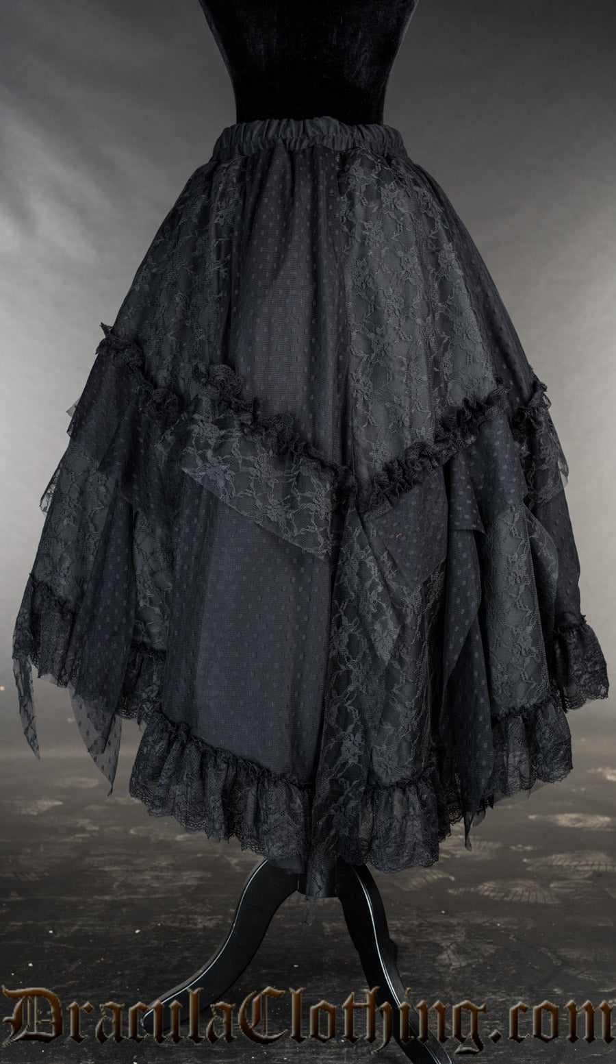 Back view of women's black ruffle skirt showing added lace details and elasticated waistband