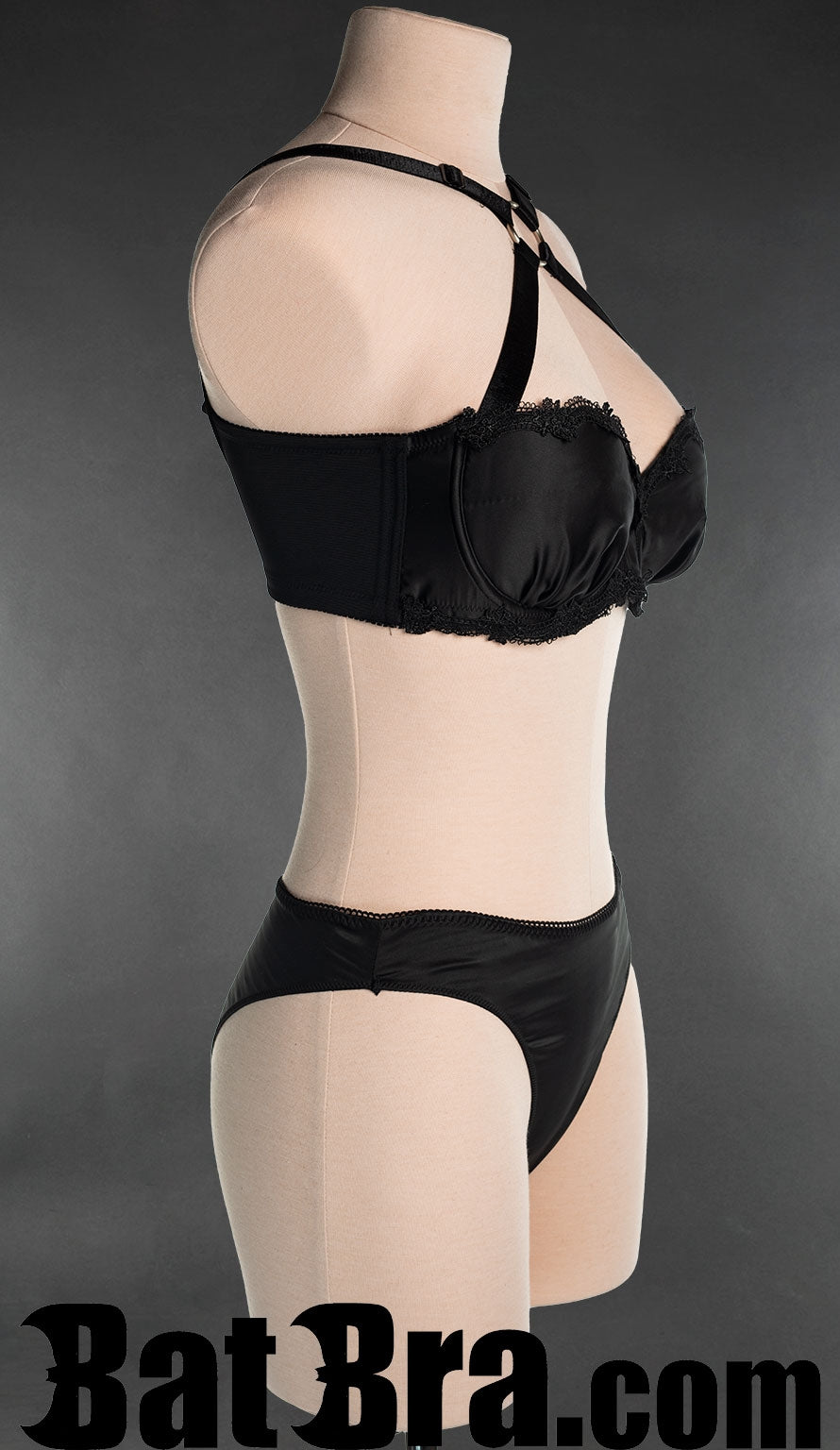 Black Satin bra with lace trim on underbust band and cups shown from the side