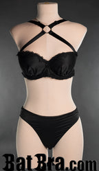 Women's black satin bra with lace details and crossover adjustable straps with o-ring