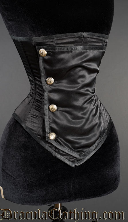 Side view of black satin underbust corset showing golden coloured buttons on front panel and shaping in the shorter sides