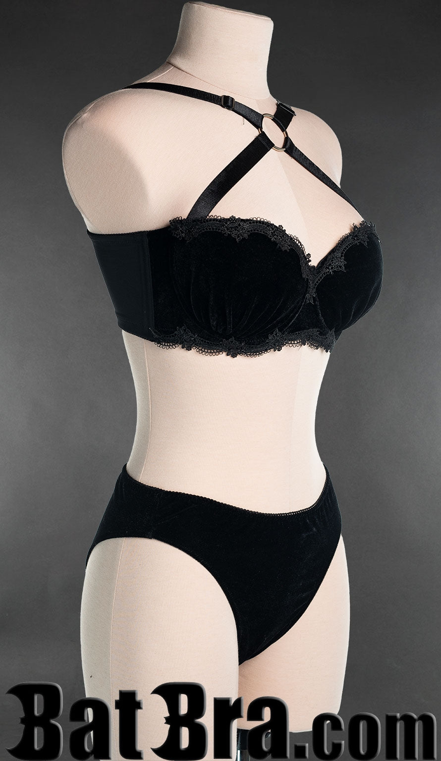Side view of black velvet lace bra, showing black lace on underbust band and cups