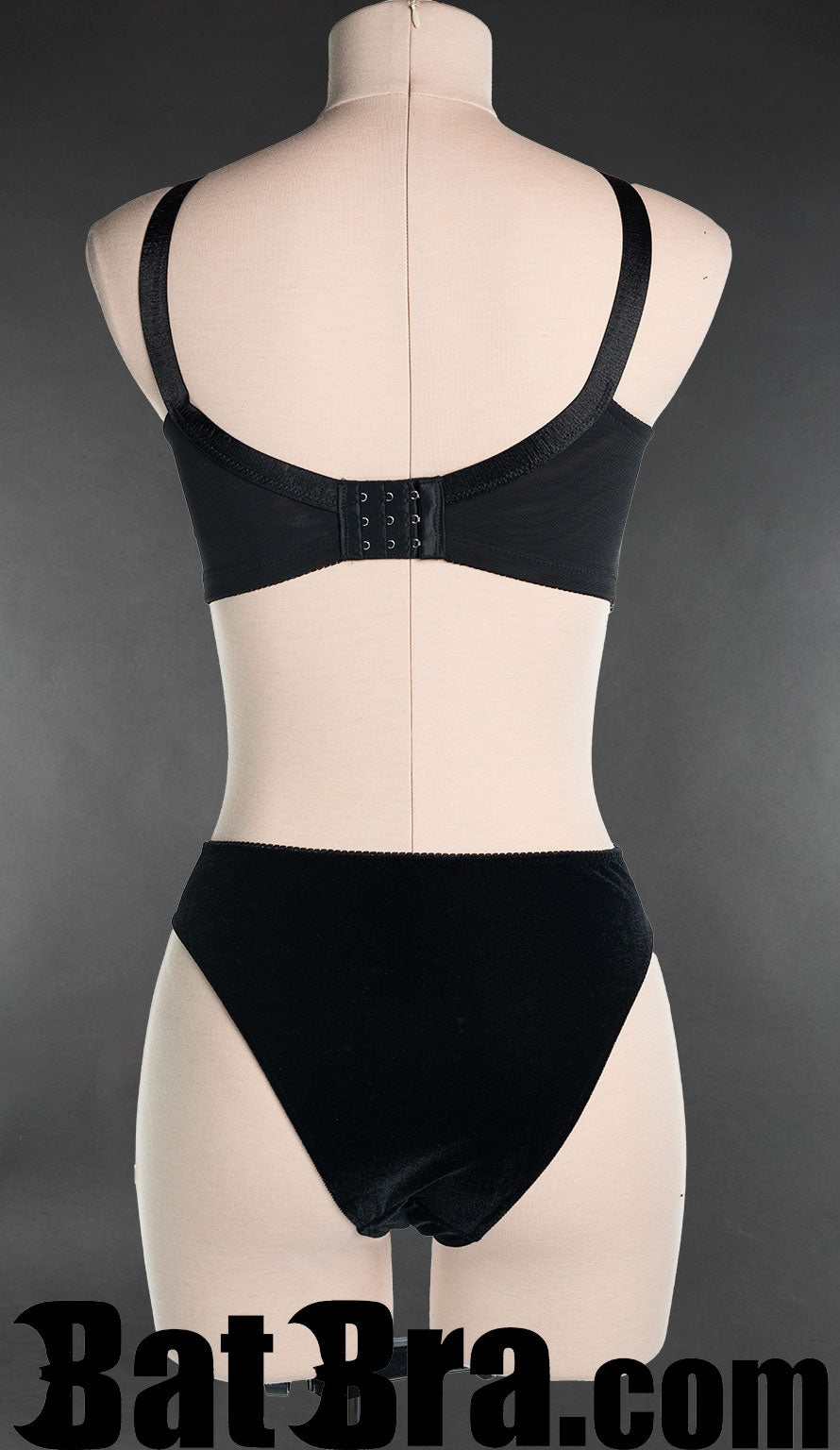 Back view of women's black bra showing traditional bra hook closure