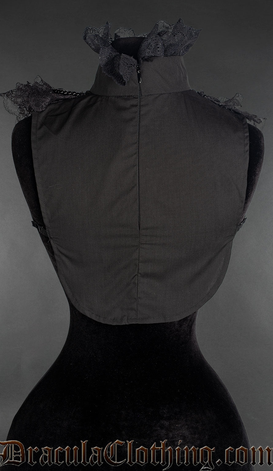 Back view of black ruffle collar showing plain cotton bodice and lace trim on the high collar