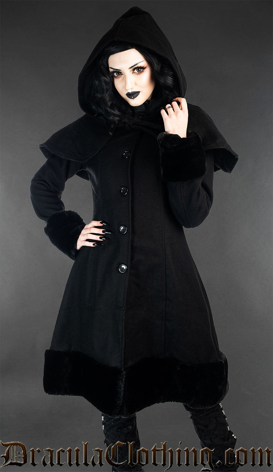 Women's black wool winter coat with faux fur trim and removable hood and cape