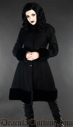 Hood down view of women's winter coat made from black wool and faux fur trim