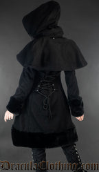Back view of women's black winter wool coat showing adjustable corset-style lacing and removable cape