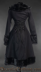 Back view of black winter women's coat with faux fur details showing adjustable corset style lacing in the torso
