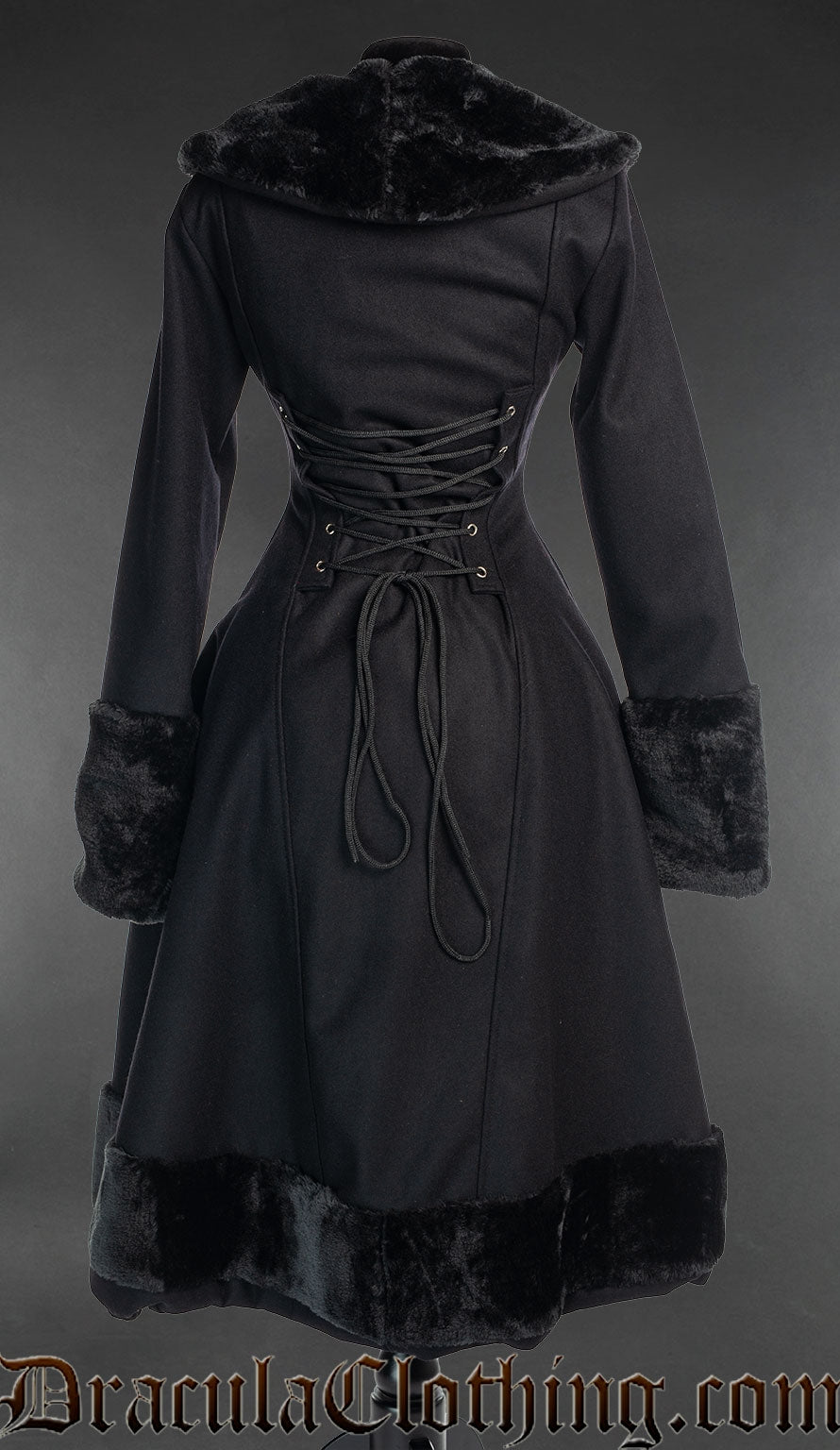 Back view of black winter women's coat with faux fur details showing adjustable corset style lacing in the torso