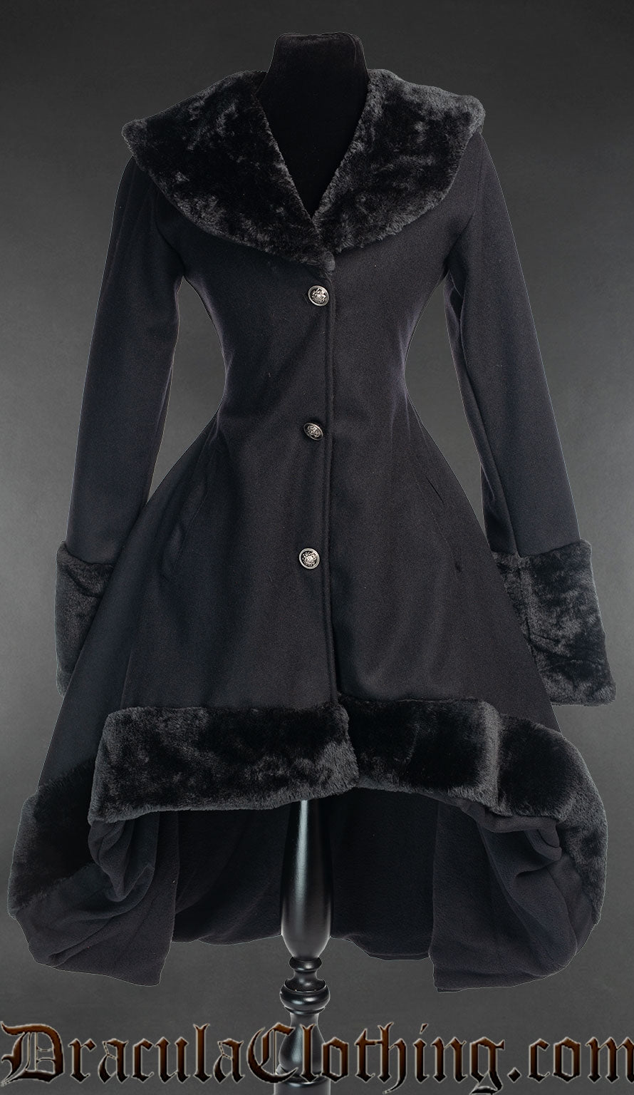 Women's black wool winter coat in short high low style with faux fur collar cuffs and hem